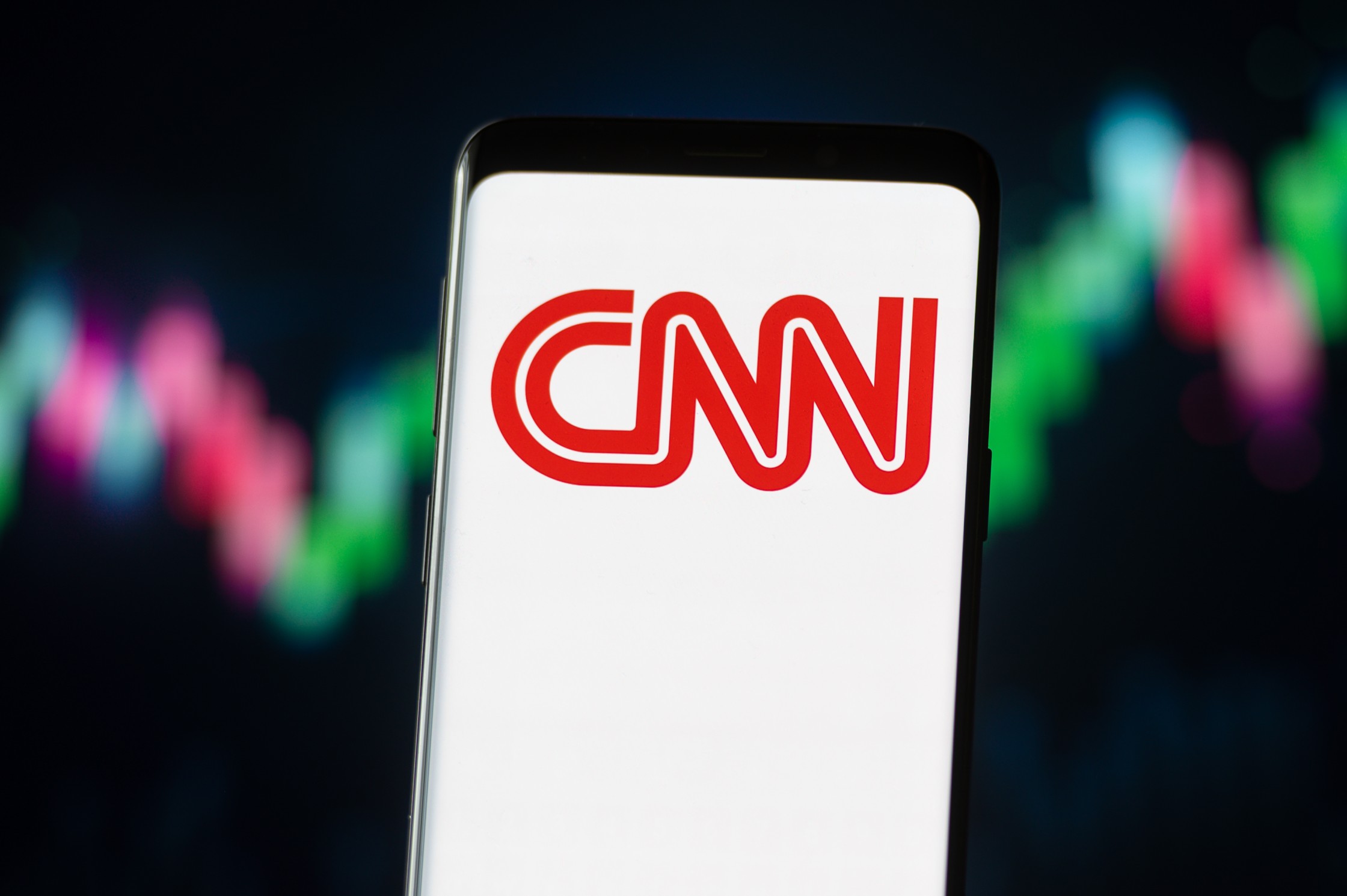 A picture of the CNN logo on a smart phone screen.