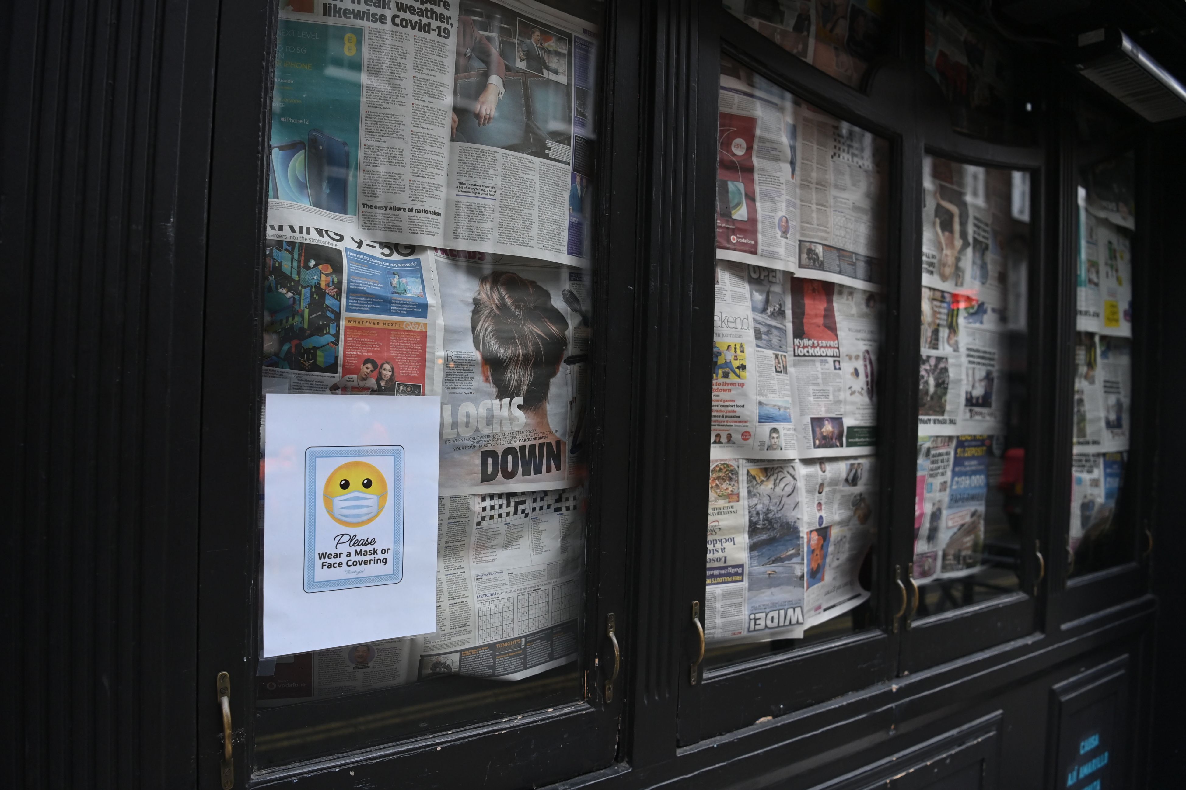 A business windows are covered in newspaper in London, Britain, 06 November 2020. On 05 November 2020 until 02 December 2020 Britain is in lockdown with government advise to stay at home, avoid meeting people you do not live with and to close certain businesses and venues. 