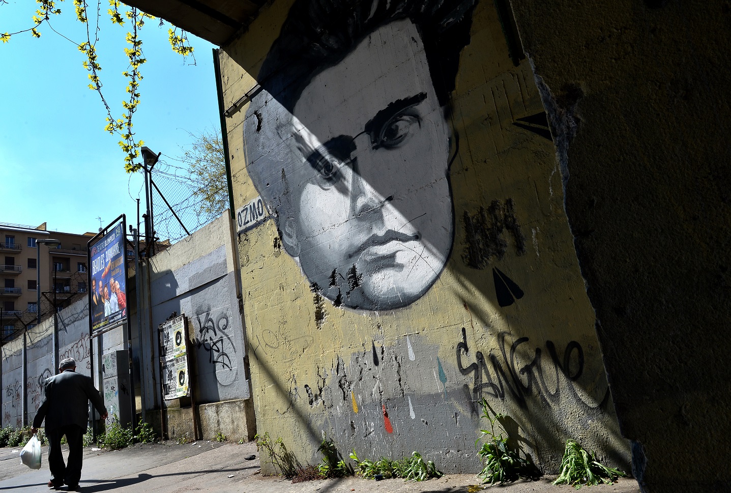A graffiti by Italian artist Ozmo depicting Italian writer Antonio Gramsci covers a wall in Rome on March 31, 2014. 