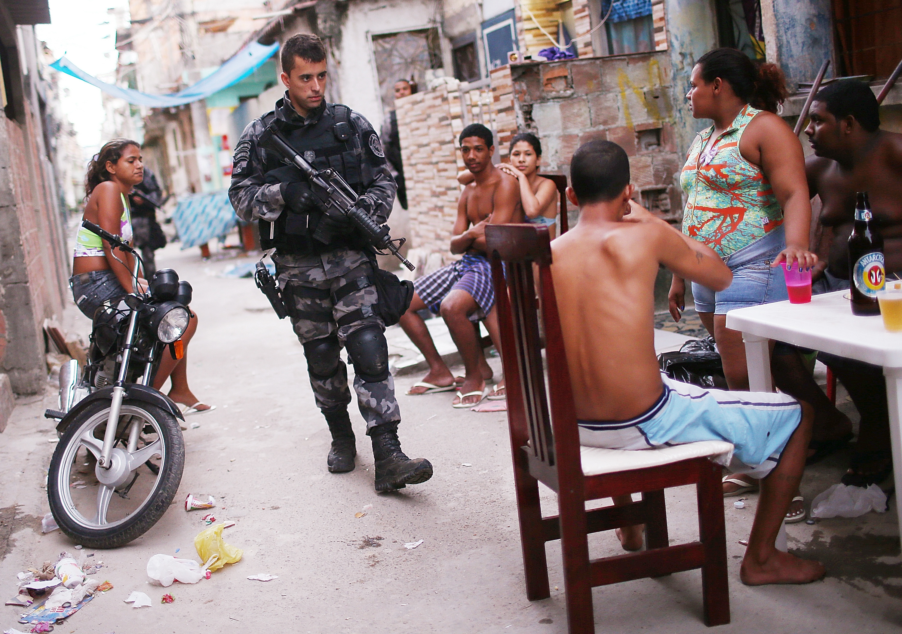 A Brazilian military police officer patrols after entering the unpacified Complexo da Mare, one of the largest 'favela' complexes in Rio, on March 30, 2014 in Rio de Janeiro, Brazil. 