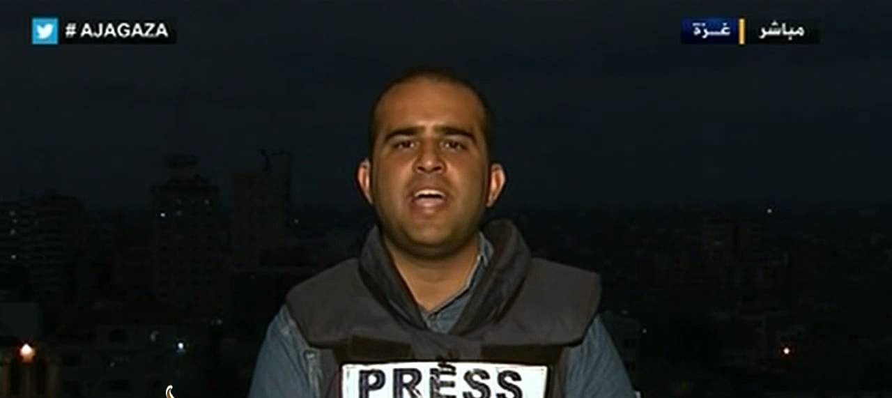 Tamer al-Mishal covering Israel's war on Gaza in 2014. 