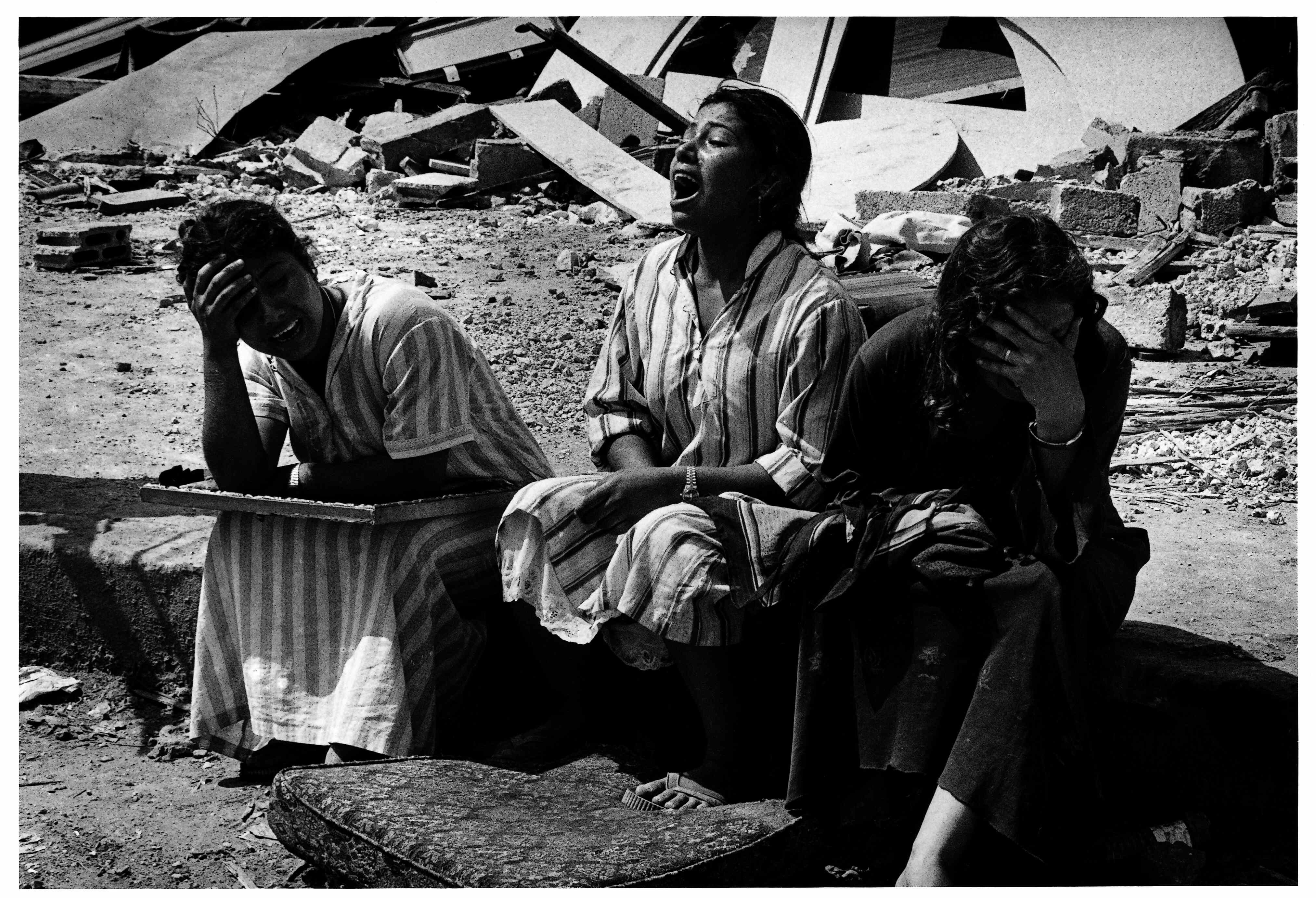 On the morning of September 18, 1982, in Shatila, Palestinians were crying and screaming after their families were killed.  (Photo courtesy of: Ryuichi Hirokawa)