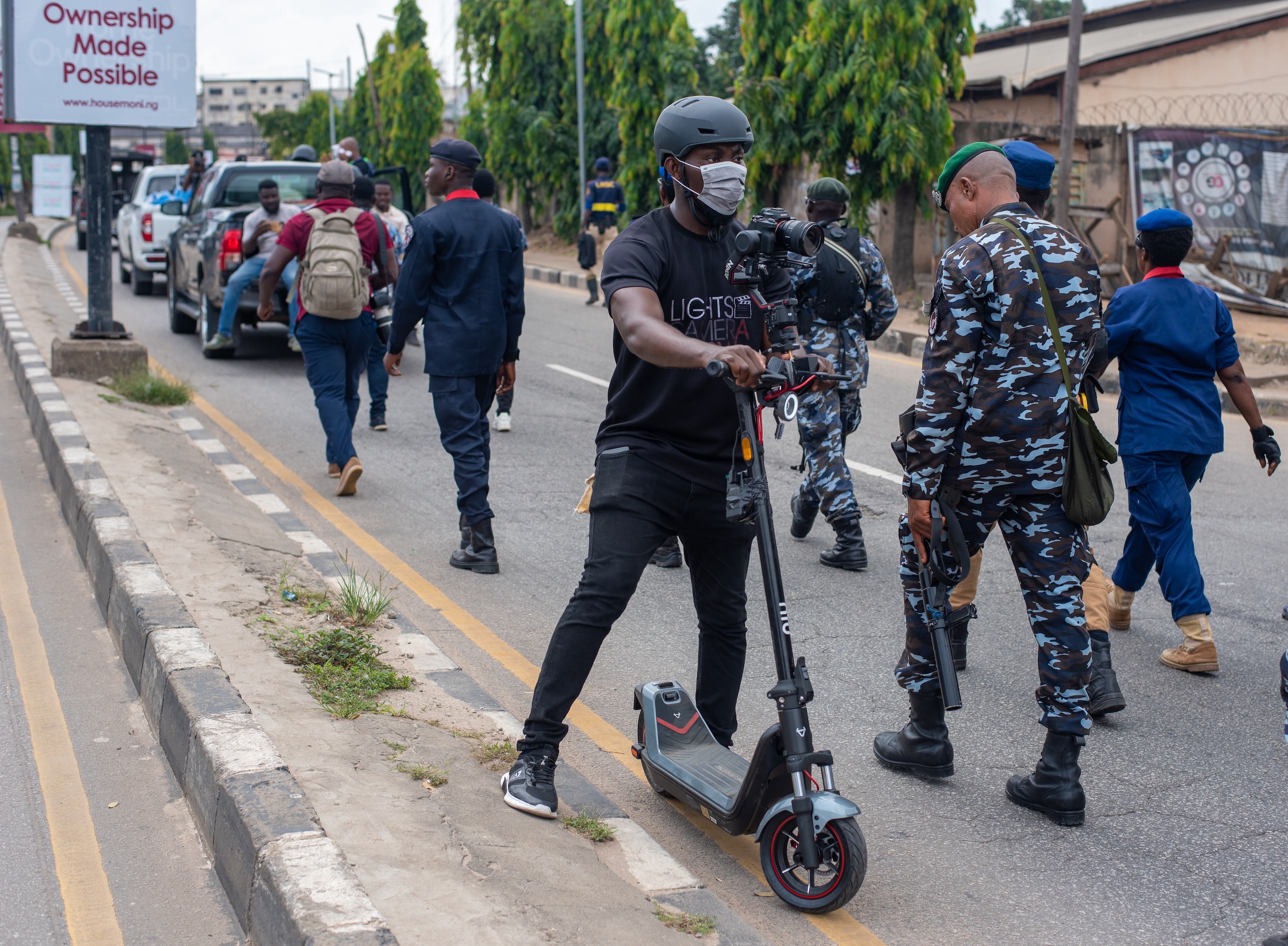 A Journalist documents a protest with his camera attached to a scooter in Lagos Nigeria, Tuesday, October 1, 2024. Nigerians are out on Independence Day to protest bad governance  By Tolu Owoeye