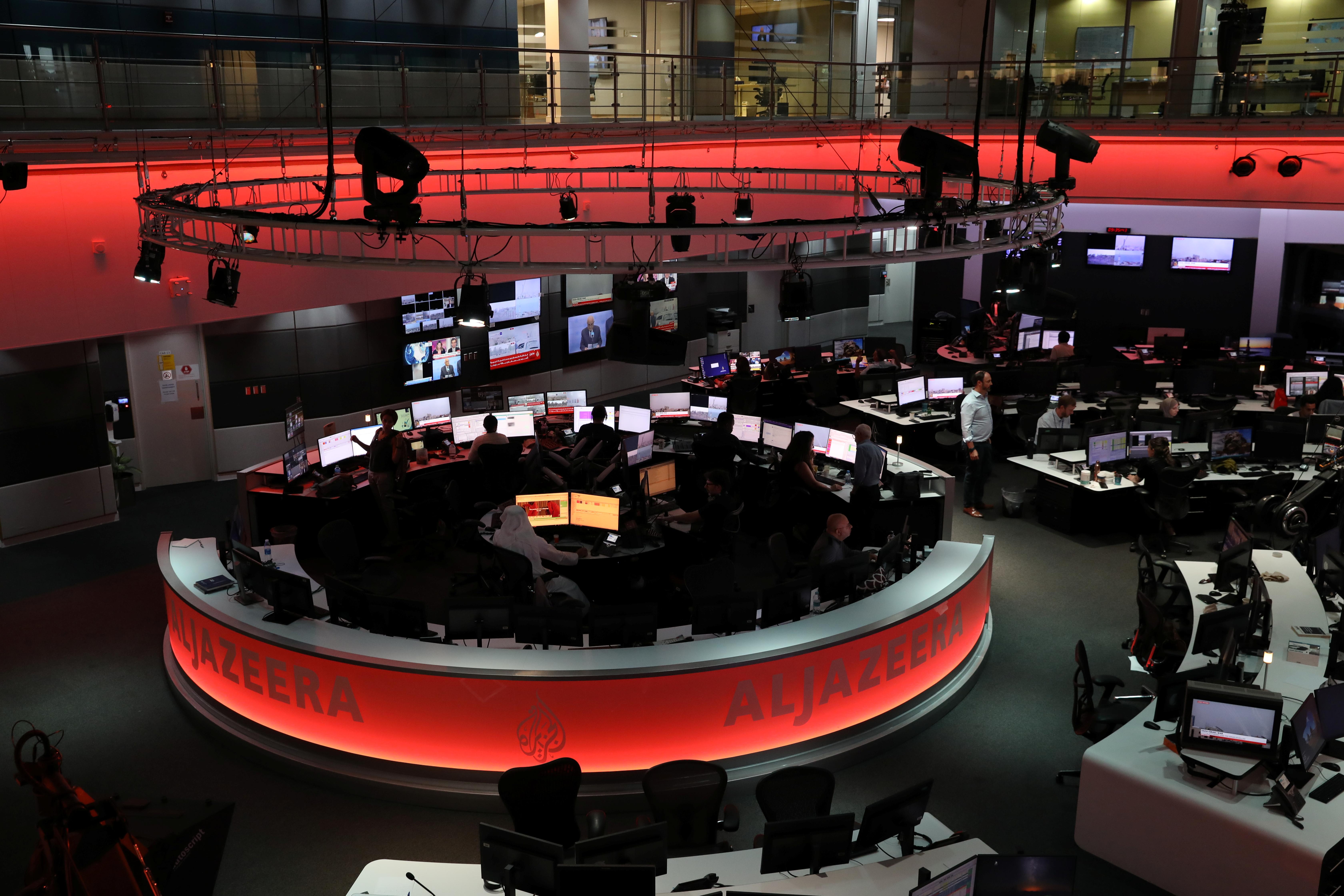 Journalists working in the newsroom at Al Jazeera Media Network headquarters in Doha, Qatar.