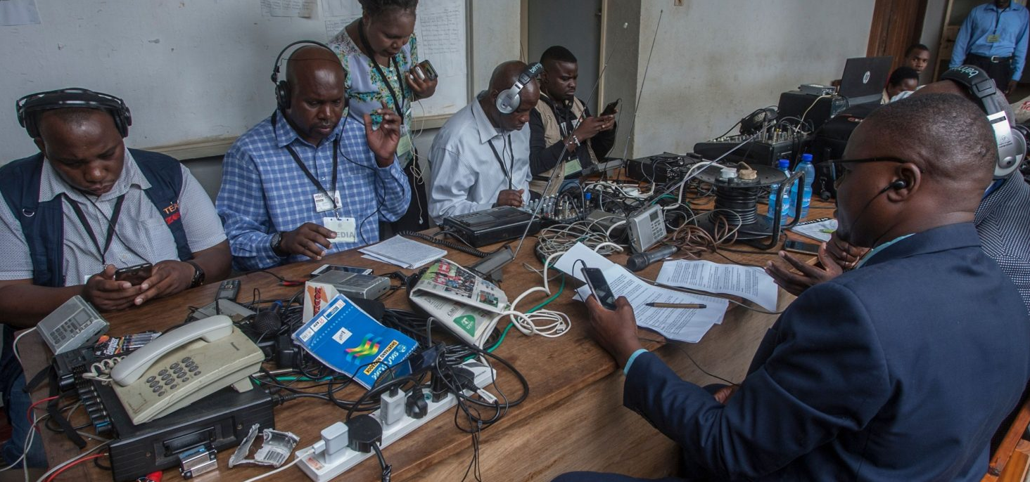 Malawian journalists cover the Constitutional Court ruling on the opposition’s challenge to the disputed 2019 presidential election, working from a crowded media setup in Lilongwe as the country awaits a historic judgment. (Photo: Amos Gumulira/AFP via Getty Images. Lilongwe, Malawi – Feb 2020)