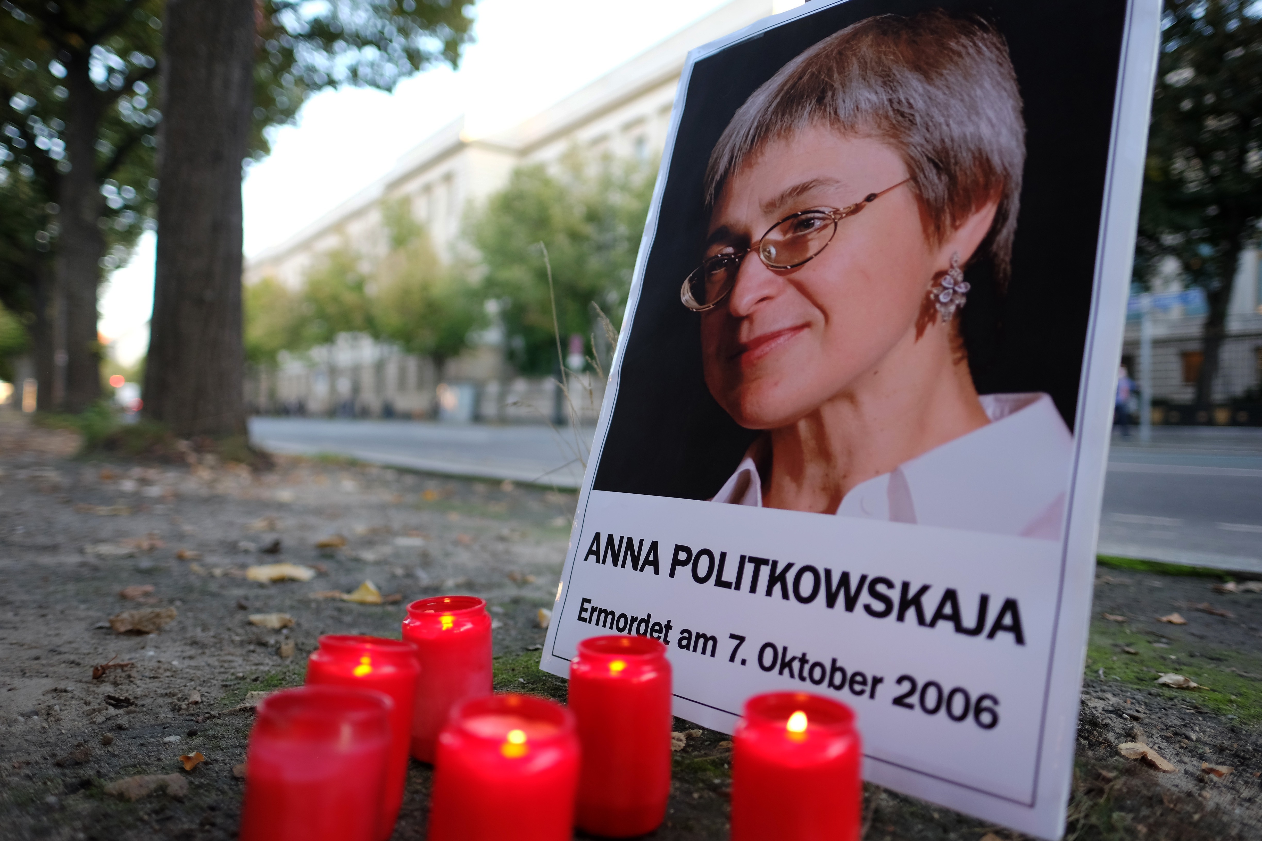 Activists from Amnesty International Germany and Reporters Without Borders gather for a vigil in front of the Russian Embassy in Berlin-Mitte to commemorate the life and legacy of Anna Politkovskaya. The gathering marks the 15th anniversary of the assassination of the renowned Russian journalist and human rights defender, who was murdered in her Moscow apartment building in 2006. The tribute underscores the ongoing international demand for justice and the protection of press freedom globally.