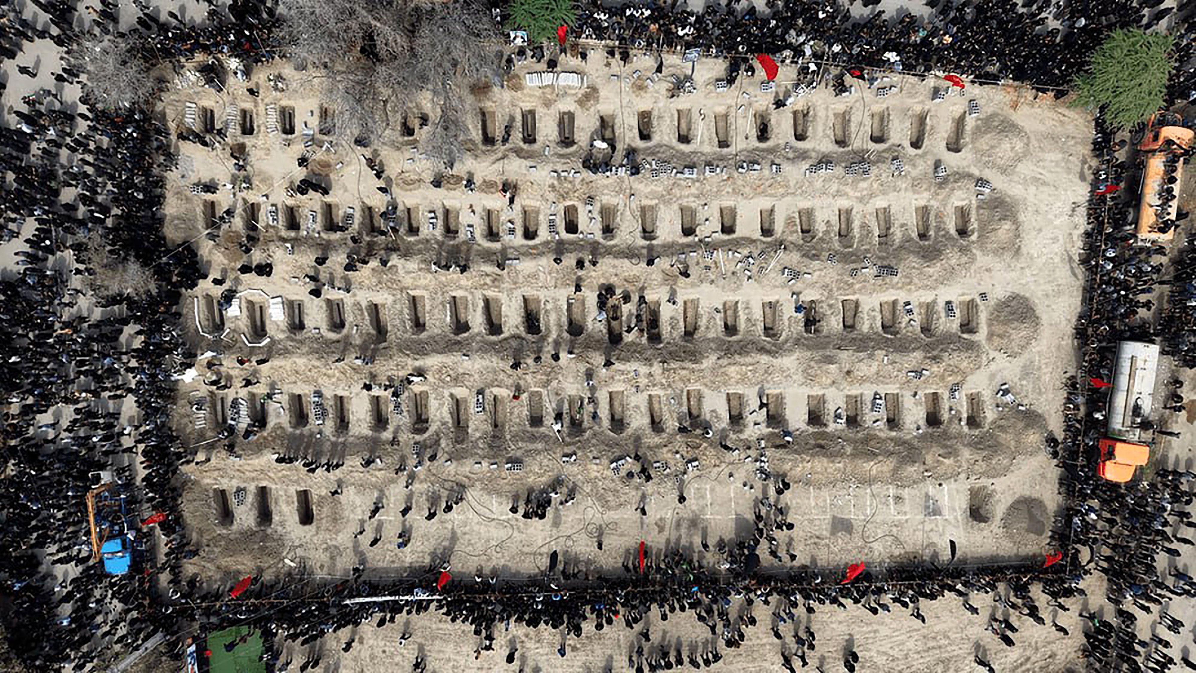Mourners dig graves during a mass funeral for children killed in a U.S.-Israeli airstrike on a primary school in Minab, Hormozgan Province. The bombardment resulted in the deaths of more than 175 female students, drawing hundreds of grieving community members to the site to memorialize the victims. The tragedy has intensified local and international outcry regarding the escalating conflict involving the United States, Israel, and Iran. (Photo: Iranian Red Crescent. Tehran, Iran – Mar 04, 2026)