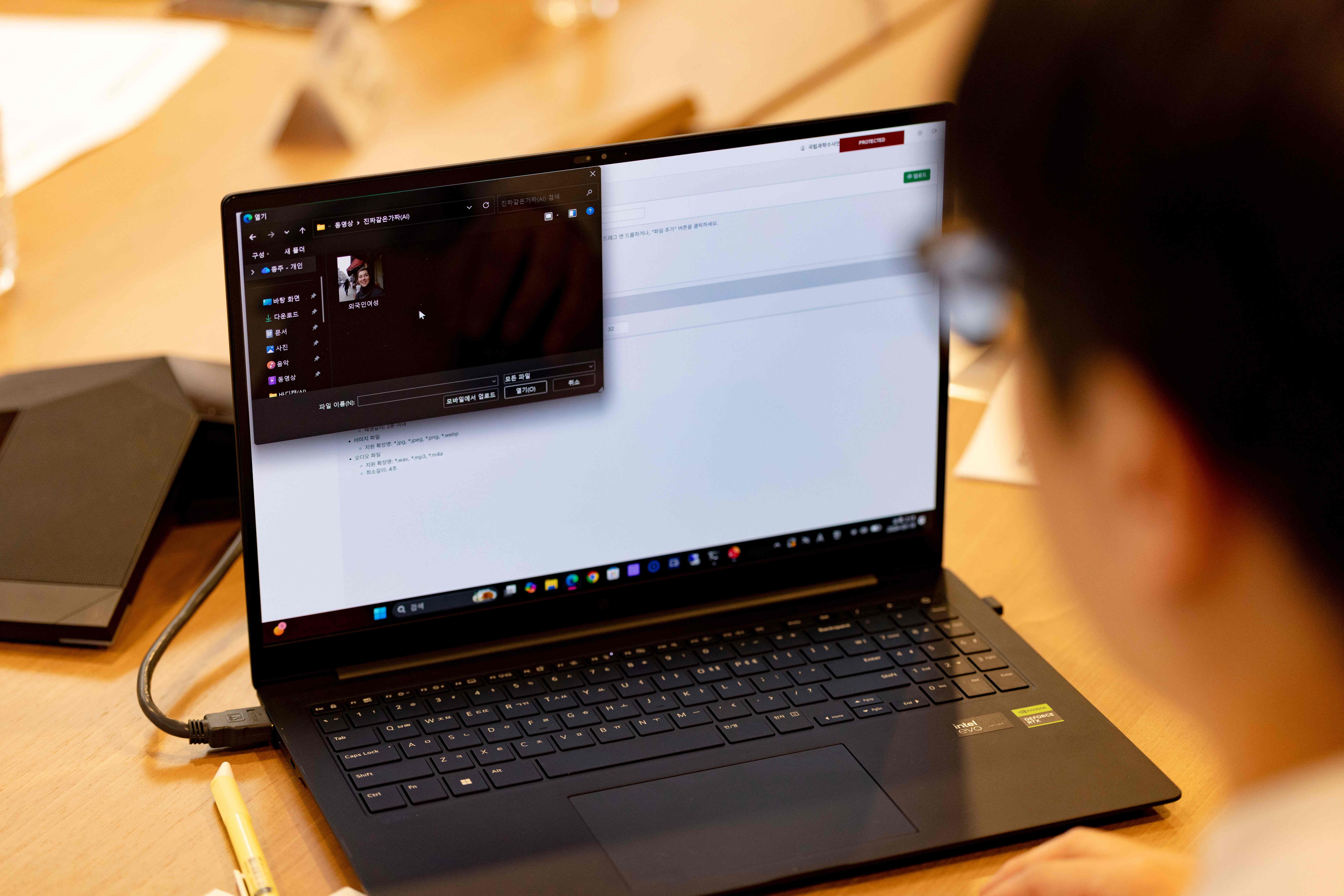 A researcher demonstrates an AI deepfake detection tool designed to combat election disinformation, as AI-generated content poses growing risks to voter choice and media integrity globally. (Photo: Chris Jung/NurPhoto via Shutterstock. Seoul, South Korea – Mar 2026)