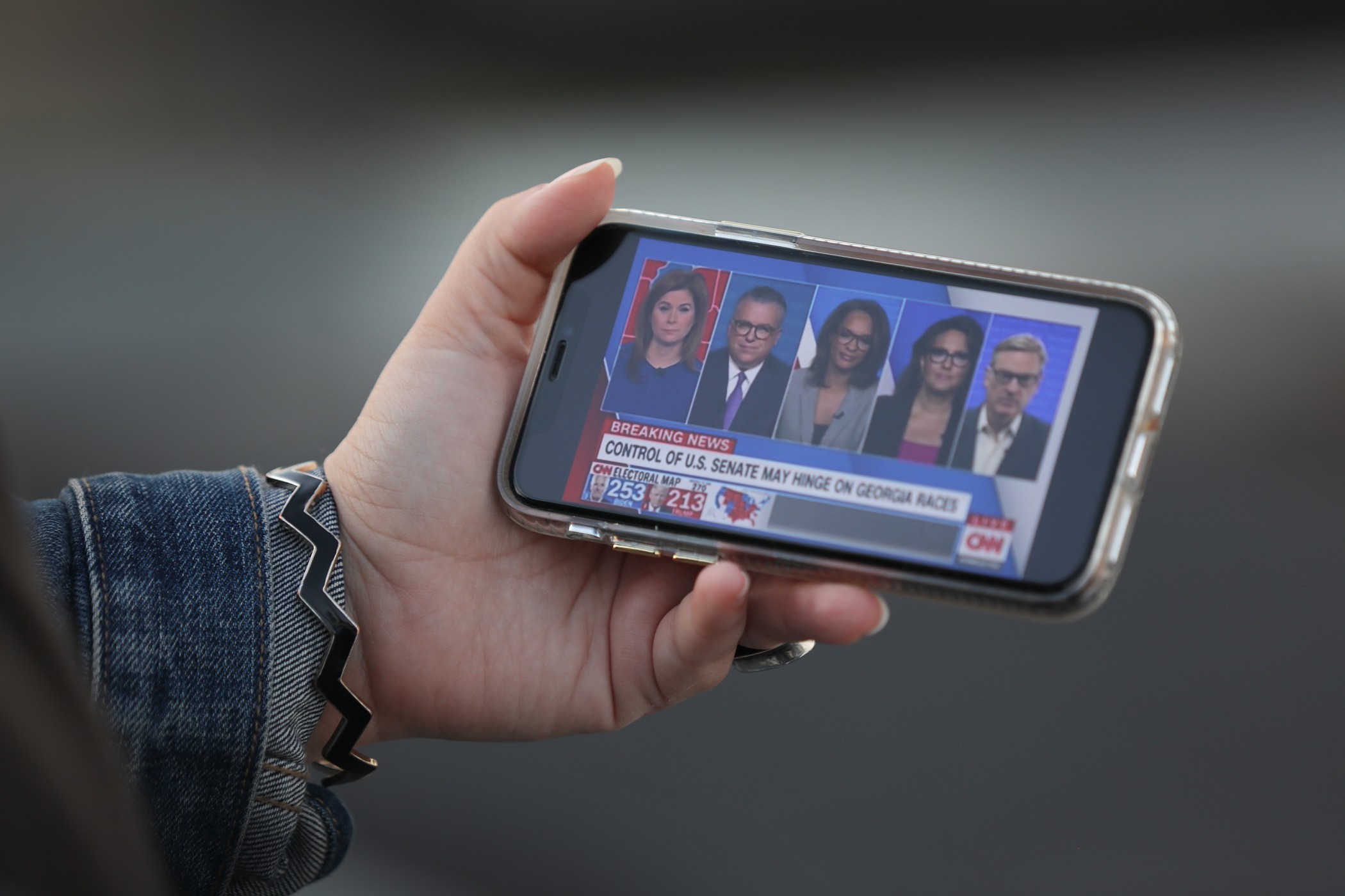 A picture of a phone displaying CNN coverage of the American election.