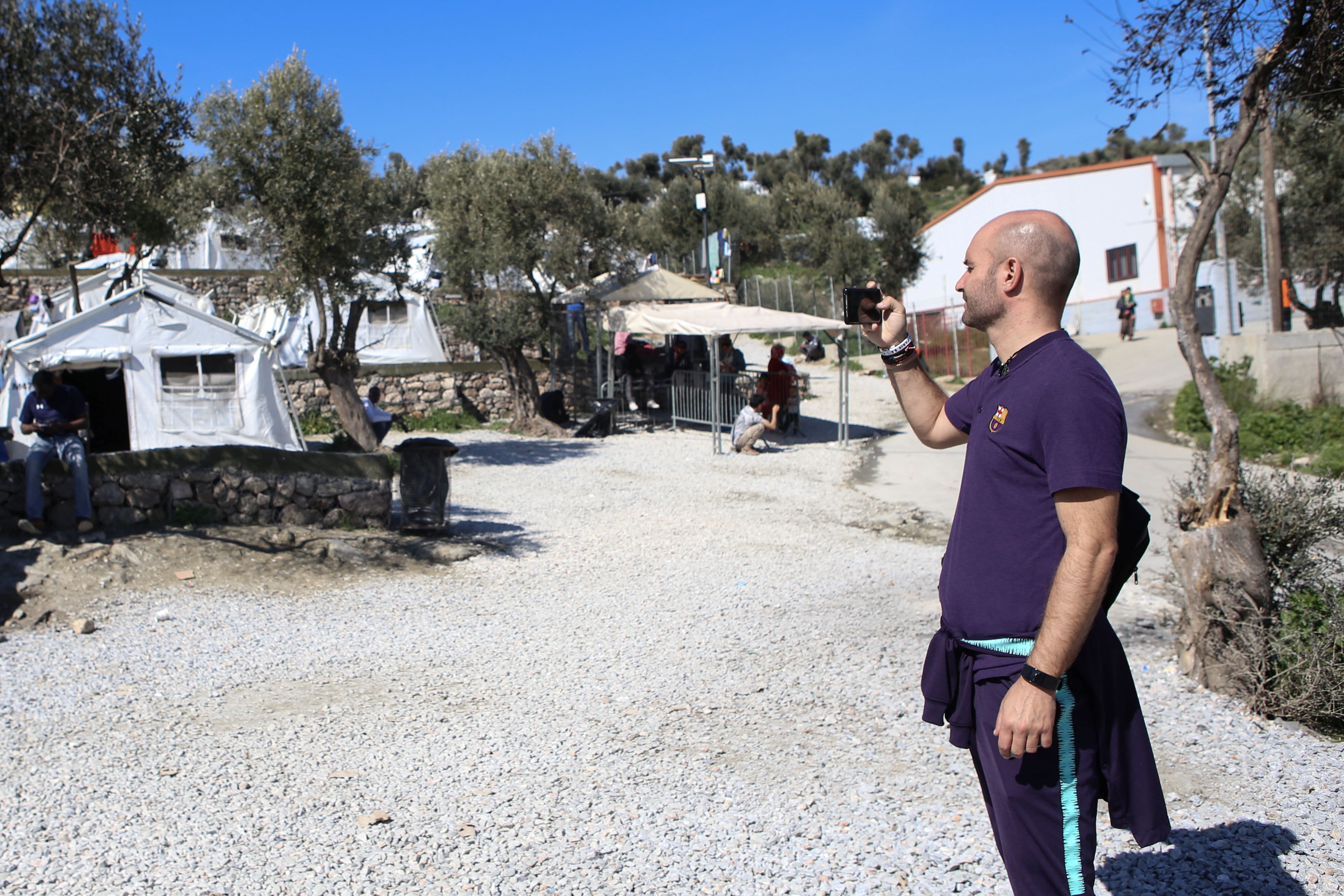 Former Barcelona FC player Jordi Ferron takes pictures in the Moria refugee camp in Lesbos, Greece. (Elias Marcou-Reuters)