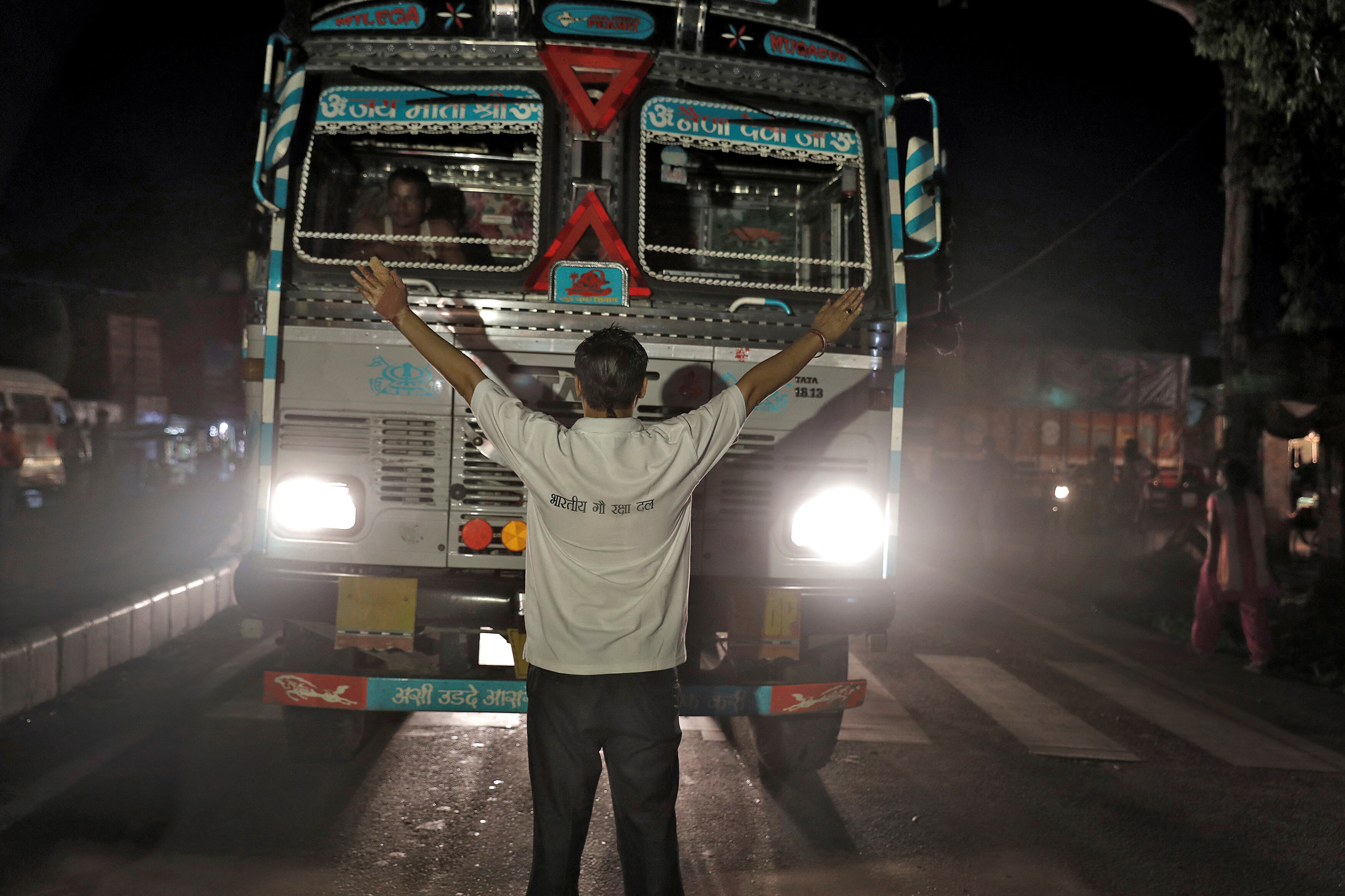 Pawan Pandit, a cow vigilante, stops a lorry at a road block near Chandigarh, India, July 6, 2017. Picture taken July 6, 2017. To match Special Report INDIA-POLITICS/RELIGION-COWS REUTERS/Cathal McNaughton