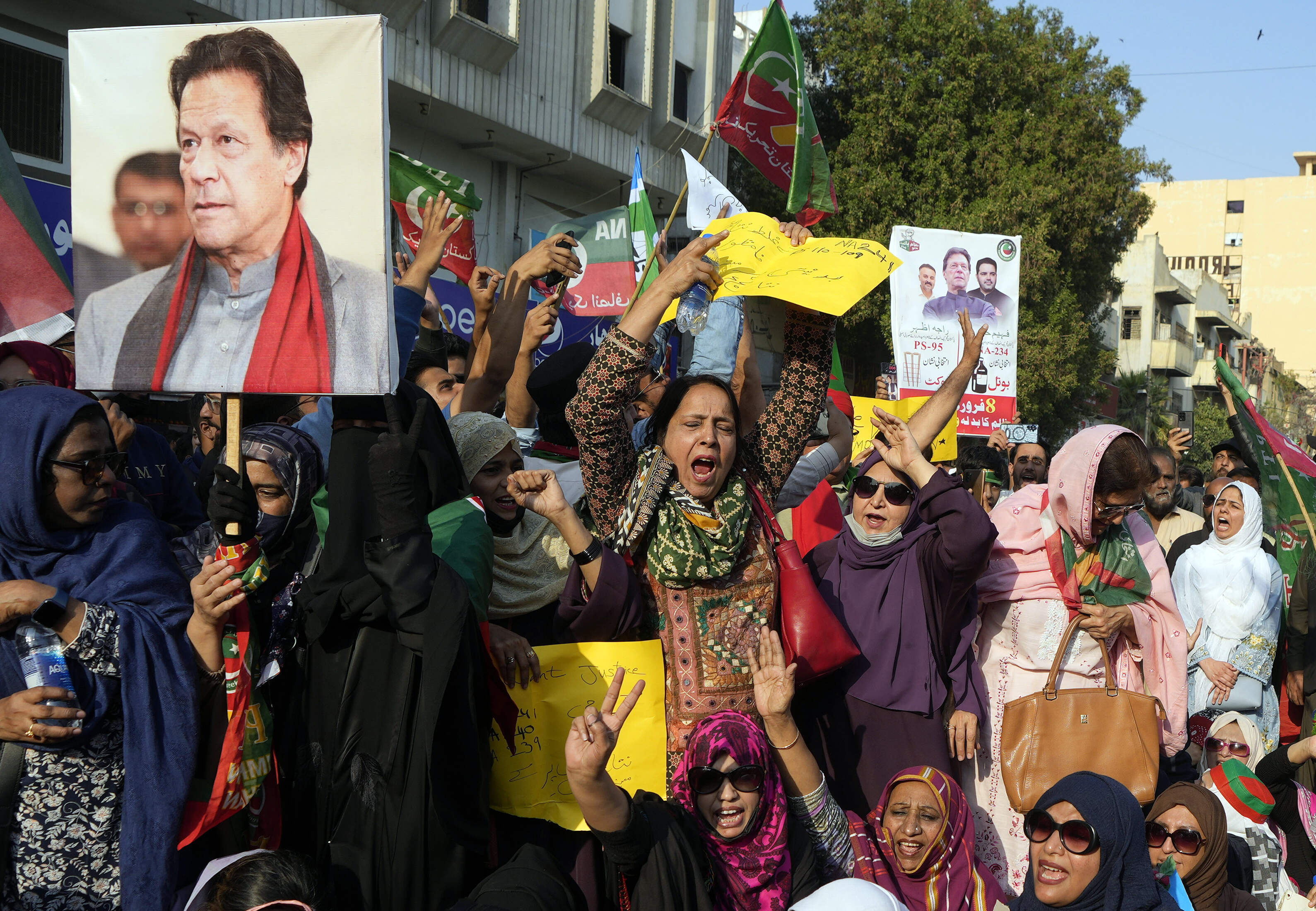 Supporters of imprisoned Pakistan's Former Prime Minister Imran Khan's and Jamaat-e-Islami party chant slogans during a protest against the delaying result of parliamentary election by Pakistan Election Commission, in Karachi, Pakistan, Saturday, Feb. 10, 2024. Pakistan on Saturday hit back at criticism over the conduct of its parliamentary elections, which were held amid sporadic militant attacks and an unprecedented stoppage of all mobile phone services. (AP Photo/Fareed Khan)