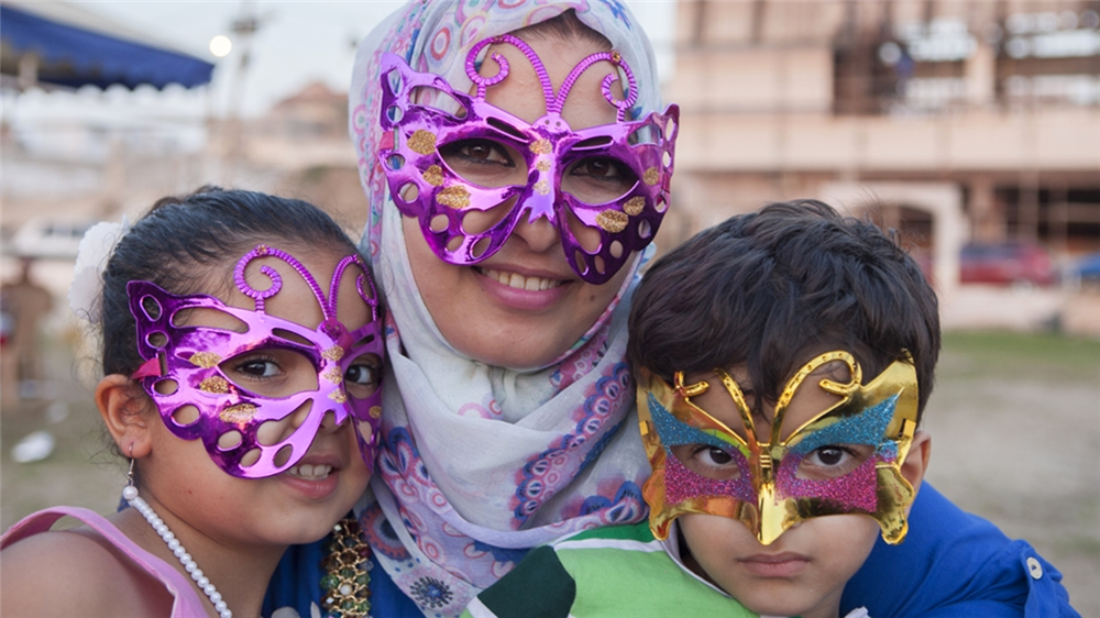 Amira with her children, Layan and Adam, during a birthday party. (Photo: Edimi Van Rejin)