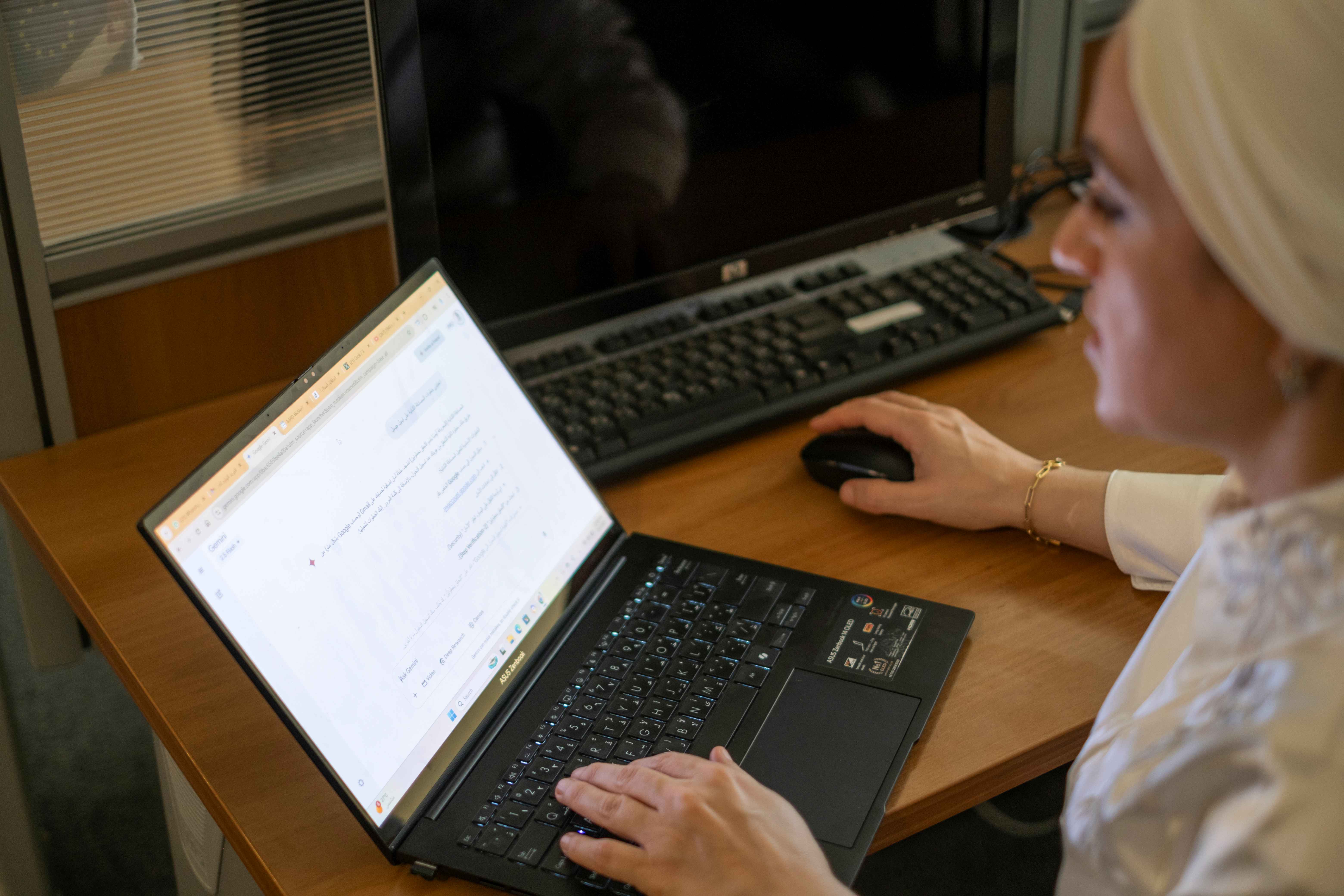 Safaa at her office using AI tools as part of her daily journalistic work (June 1, 2025), Photo Credit: UNESCO 