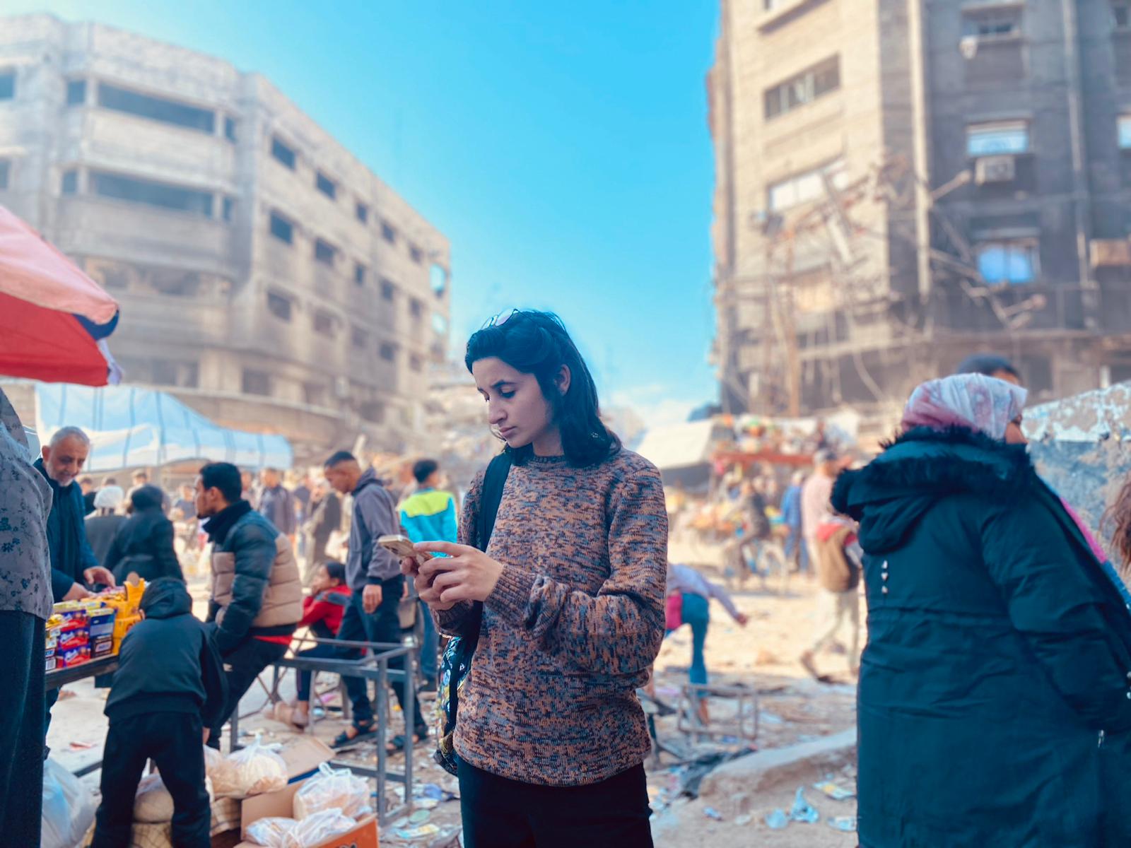 Rita Baroud of herself reporting in Al-Naser Street, Western Gaza City.