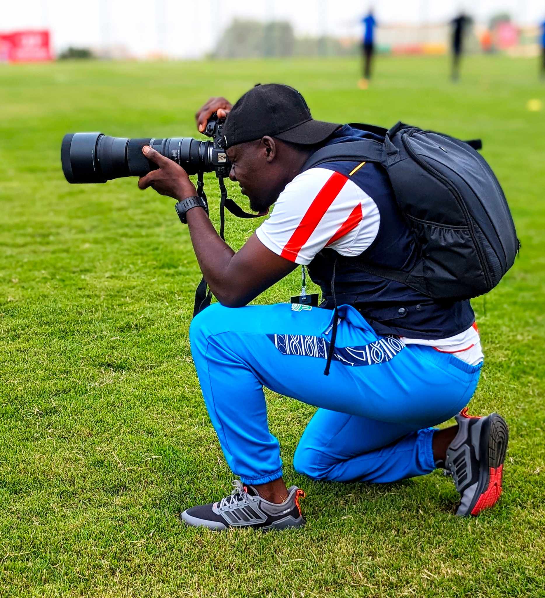 Afeseh Apong, a photojournalist, documents moments during training matches at the Bamendzi stadium in Bafoussam