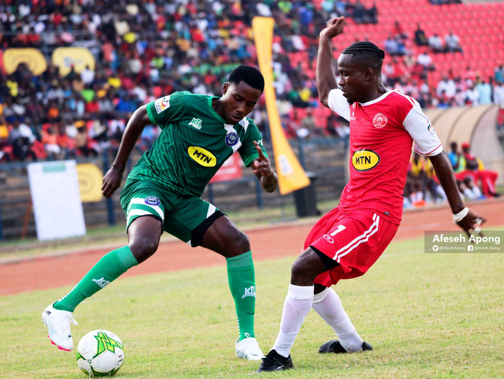 Harrison Ford Djonkep (wearing green) from Eding Sports tries to manoeuvre past Merlin Temb Ndjouck of Racing FC. Credit: Afeseh Apong.