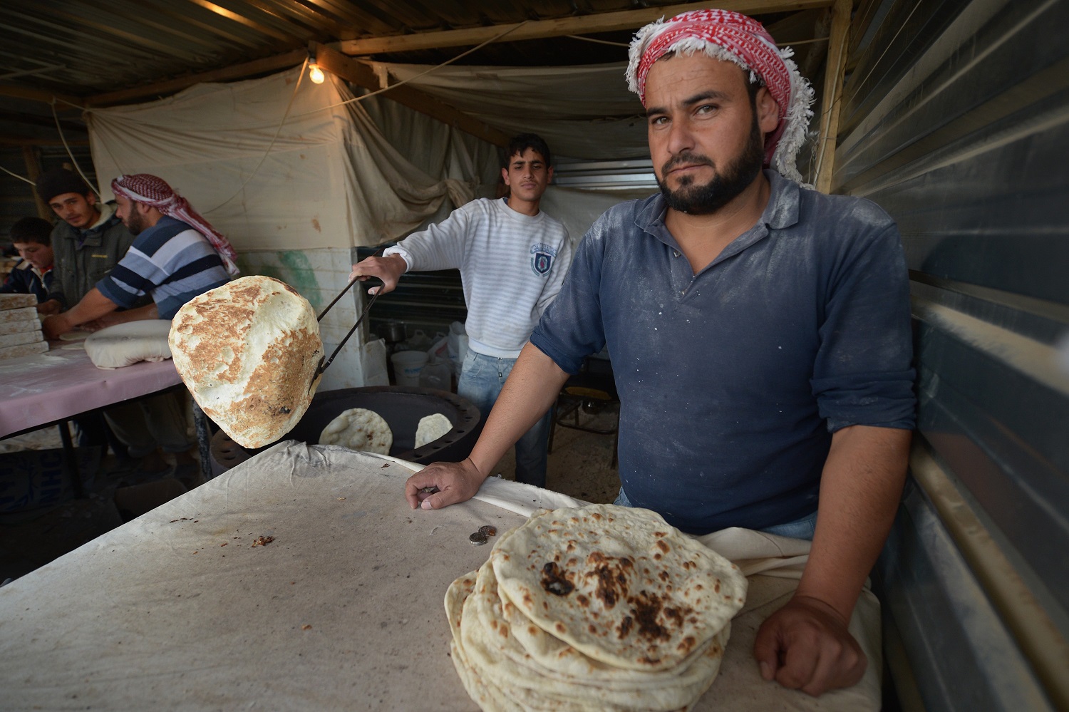 Some media outlets try to stereotype refugees as unable to contribute to the development of the local market in host countries. The picture shows a bakery in Zaatari refugee camp, Jordan. Photo: Jeff Mitchell, Getty