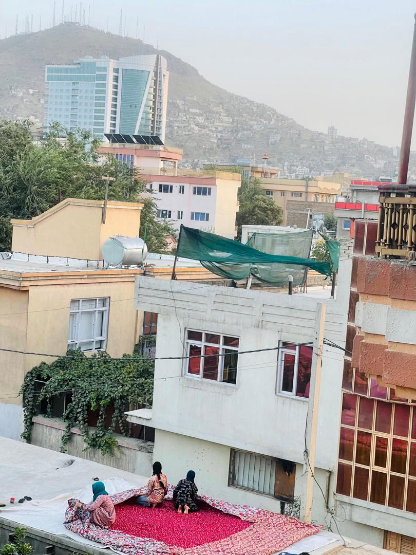 Afghan women on a roof working -Kabul - (Courtesy of Khadija Haidary)