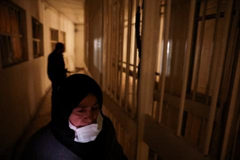Woman walking in Syrian Security prison after Assad regime is toppled
