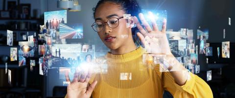 African woman in front of multiple virtual apps