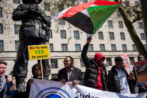 Sudanese protesting with flag