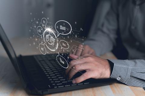 Laptop with digital 3D representing content moderation 