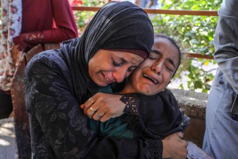 Palestinian mother and daughter crying over killed family in Gaza