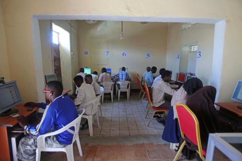 Somali residents navigate the digital world at an internet cafe in the Hodan district of Mogadishu, Somalia. The facility, featuring numbered workstations and providing essential web access, serves as a vital hub for information and communication within the local community. (Photo: REUTERS/Feisal Omar. Mogadishu, Somalia – Oct 09, 2013)