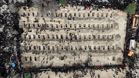 Mourners dig graves during a mass funeral for children killed in a U.S.-Israeli airstrike on a primary school in Minab, Hormozgan Province. The bombardment resulted in the deaths of more than 175 female students, drawing hundreds of grieving community members to the site to memorialize the victims. The tragedy has intensified local and international outcry regarding the escalating conflict involving the United States, Israel, and Iran. (Photo: Iranian Red Crescent. Tehran, Iran – Mar 04, 2026)