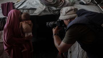 A journalist taking a picture in gaza