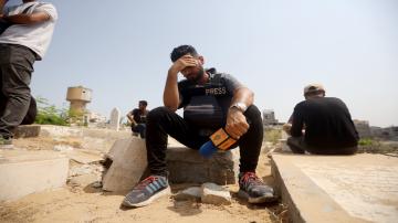 Relatives and colleagues of the Al Jazeera correspondents Anas al-Sharif and Mohamed Qraiqea; photojournalists Ibrahim Dahir and Moumin Alaywa; and assistant photojournalist Mohammed Noufal, who were killed in an Israeli airstrike on a journalists' tent near the Al-Shifa Hospital in the Gaza City center, mourn during the funeral ceremony on August 11, 2025, in Gaza